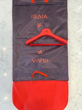 Isaia garment bag, hanger & coral pin